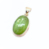 Kyanite, large green stone in silver pendant