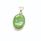 Kyanite, large green stone in silver pendant