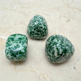 Jade with white spots from China per gram