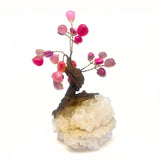 Bonsai tree with rose quartz on a rock crystal base
