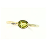 Peridot, square claw set ring