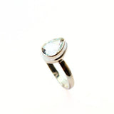 White topaz droplet faceted in silver ring