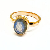 Labradorite faceted oval in gold ring