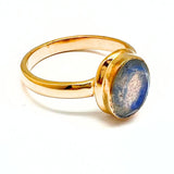 Labradorite faceted oval in gold ring