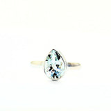 White topaz droplet faceted in silver ring