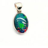 Opal, oval silver pendant with small silver edge