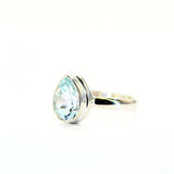 White topaz droplet faceted in silver ring