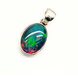 Opal, oval silver pendant with small silver edge