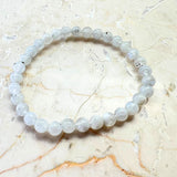 Rainbow pattern white bracelet with round beads