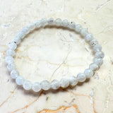 Rainbow pattern white bracelet with round beads