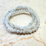 Rainbow pattern white bracelet with round beads