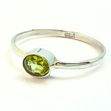 Peridot, square claw set ring
