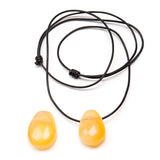 Calcite orange tumbled pendant with holes